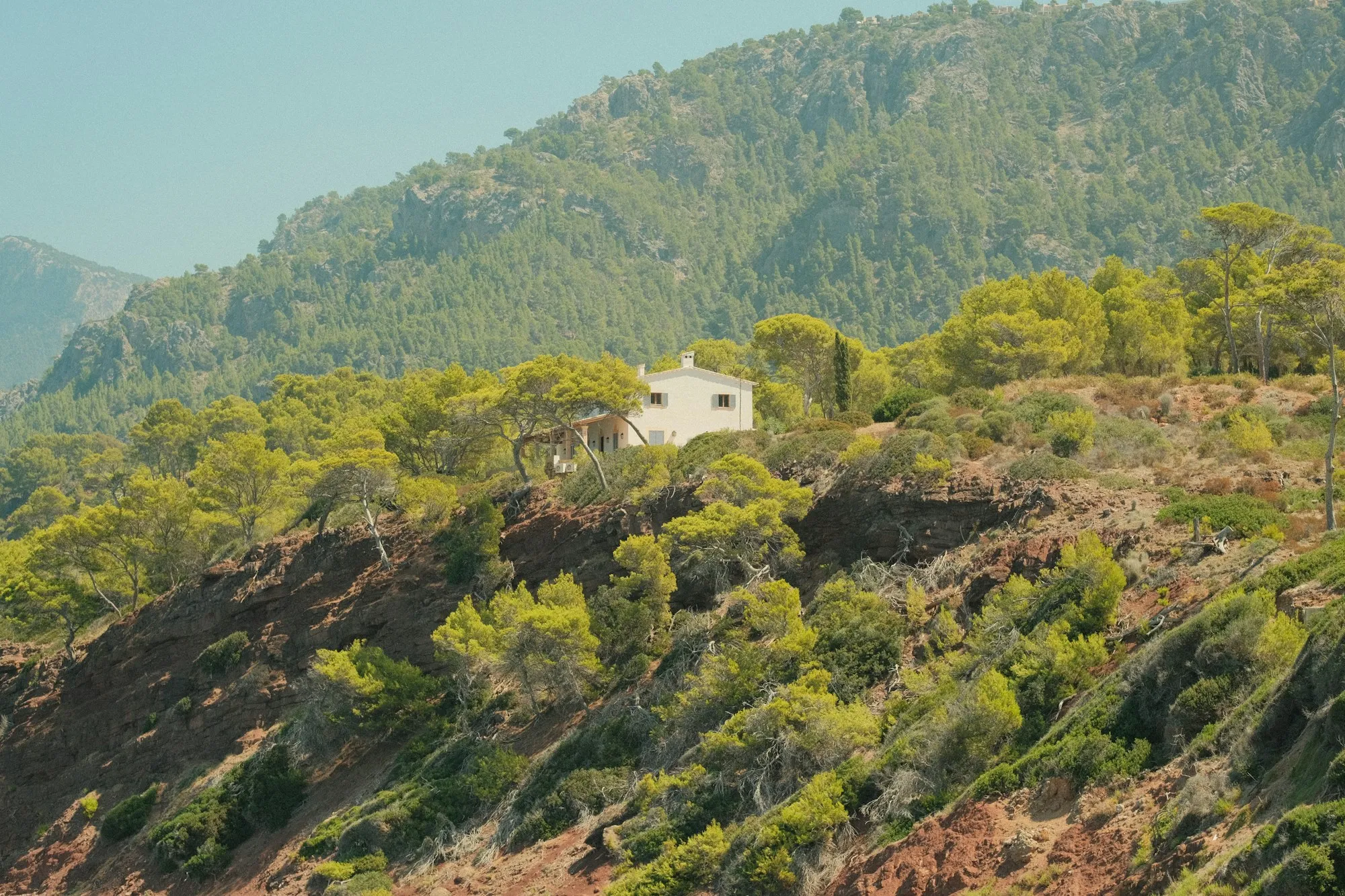 House on a wooded mountain lot with a crawl space foundation