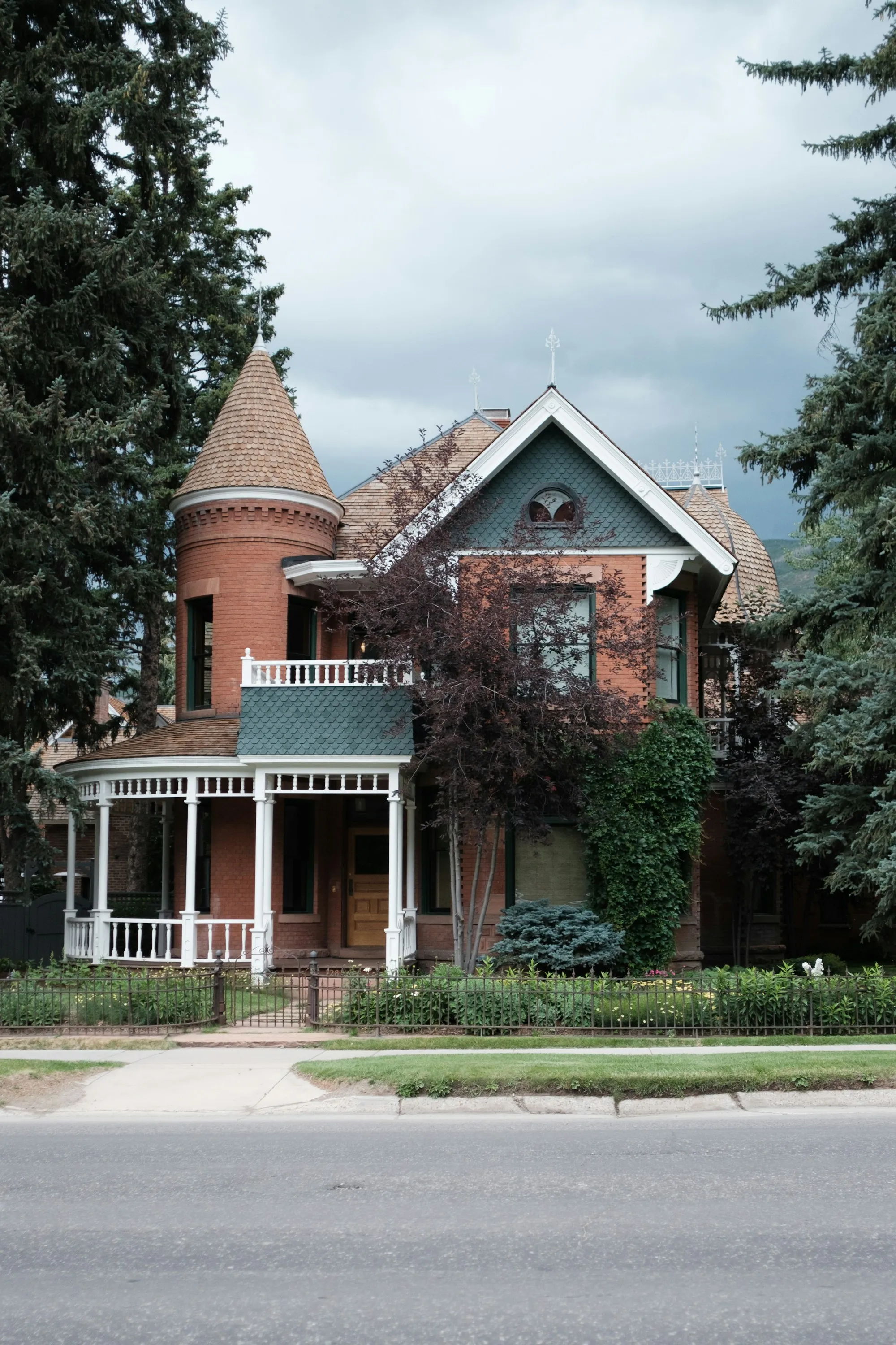 Victorian-era brick home with a front porch