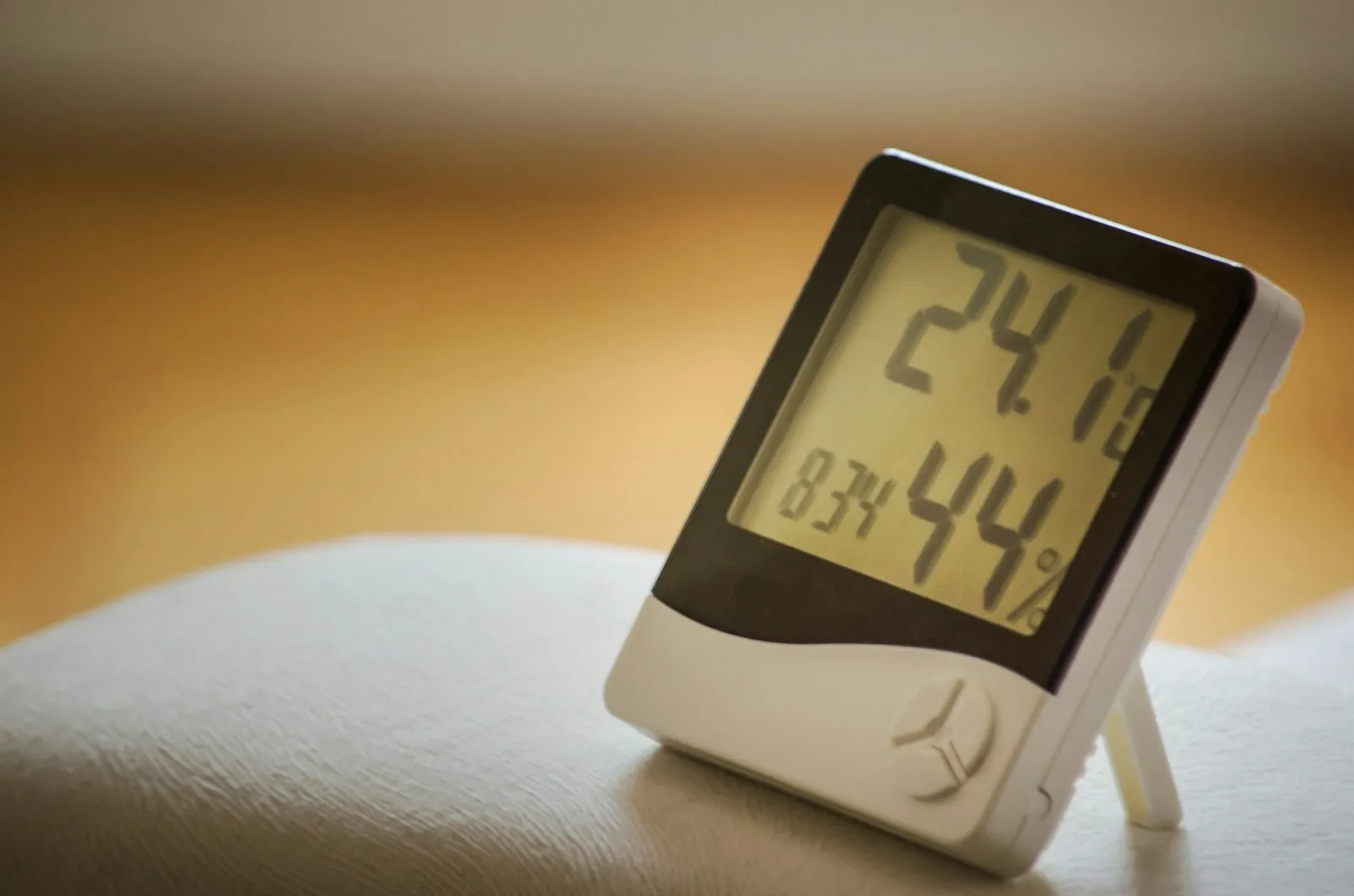 Digital hygrometer displaying a 44 percent relative humidity reading
