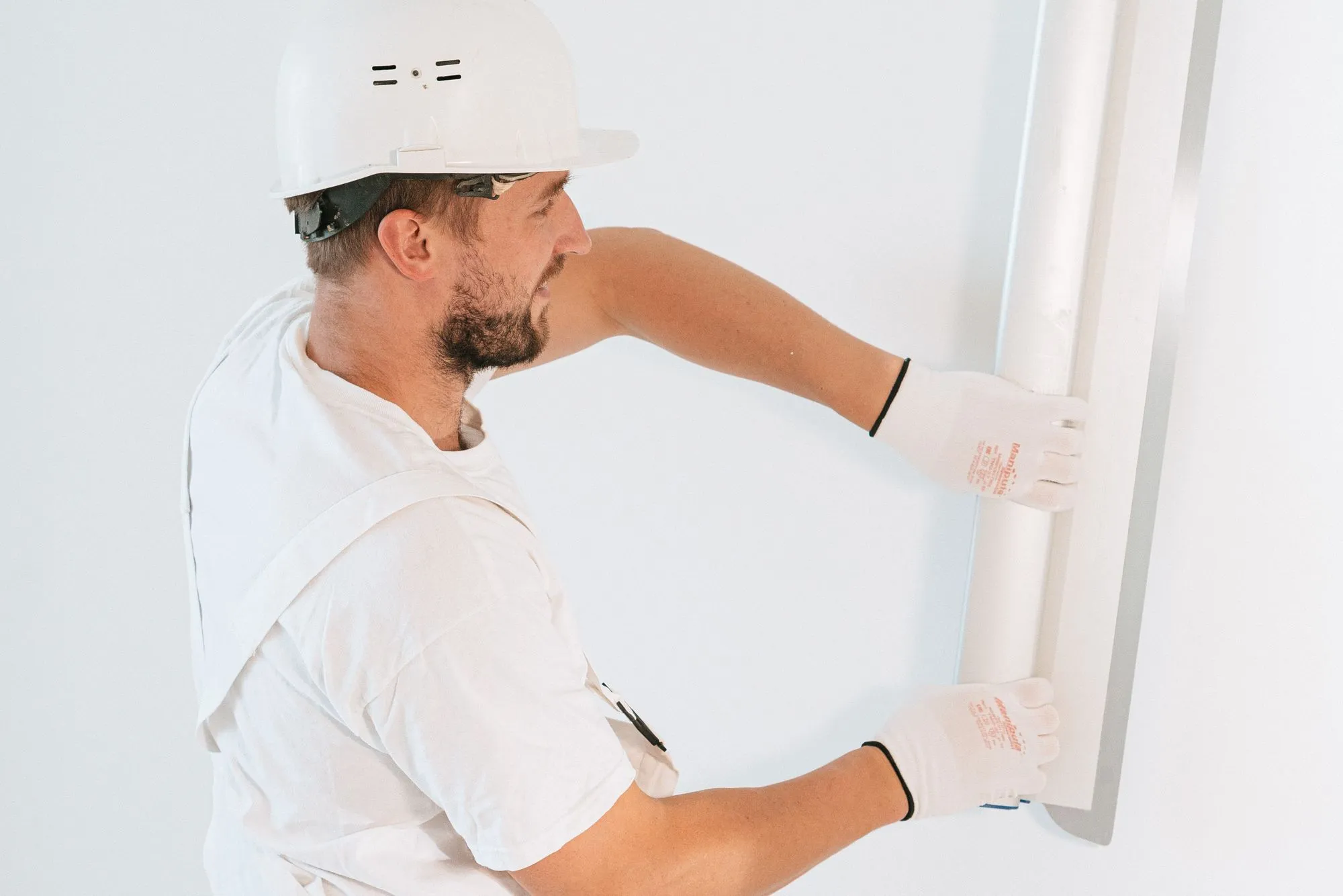 Plastic containment wall with a zipper door and a HEPA air scrubber